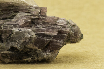 Striking specimen of elbaite tourmaline crystals, intertwined with quartz and lepidolite, set against a vibrant yellow backdrop, highlighting the intricate details and natural beauty of minerals