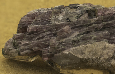 Striking specimen of elbaite tourmaline crystals, intertwined with quartz and lepidolite, set against a vibrant yellow backdrop, highlighting the intricate details and natural beauty of minerals
