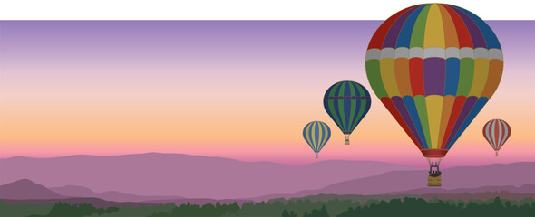 several hot air balloons floating above scenic landscape with a sunset sky in the evening, suitable for web banner or header © yojo