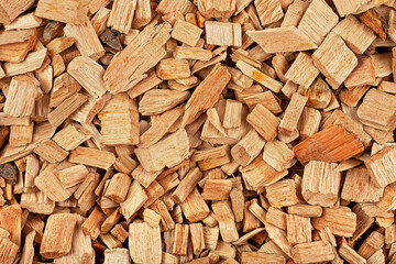 Pile of mixed wood chips as background, top view. Wood chips for smoking meat and fish.