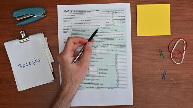 2025 tax return, April 15 tax day, 1040 form, close-up hand with pen. Overwhelmed taxpayer, stressed, confused. Income tax, finances.