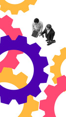 Two businessmen shaking hands while standing near large colorful gears, representing partnership,...
