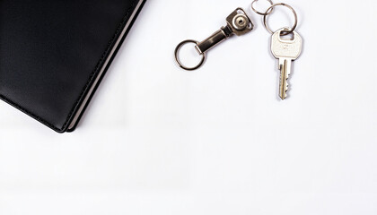 Luxury real estate branding with silver keys and contract folder, professionalism