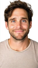 Obraz premium A man with a beard and a blue shirt is smiling. He is wearing a white shirt underneath