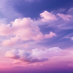Obraz premium A gentle, dreamy sky with a gradient of pink and purple shades, adorned with wispy white clouds.