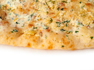 Flat sour dough bread with four cheeses on white background. Tasty food. Italian style dish with high quality ingredients, Bakery product.
