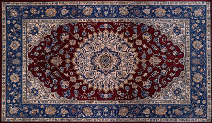 Obraz premium Luxury Persian carpet with intricate floral medallion design in red, blue and beige showcasing traditional craftsmanship and elegance