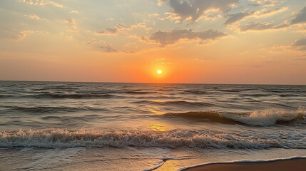 Fototapeta premium Serene Sunset Over Ocean with Gentle Waves on a Sandy Beach