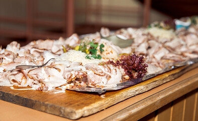 Gourmet meat platter with selection of cold cuts and fresh garnishes