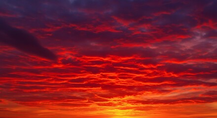 Fototapeta premium Bright red sunset. Dramatic evening sky with clouds.