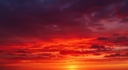 Naklejka premium Bright red sunset. Dramatic evening sky with clouds.