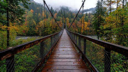 Fototapeta premium Autumnal Suspension Bridge over River