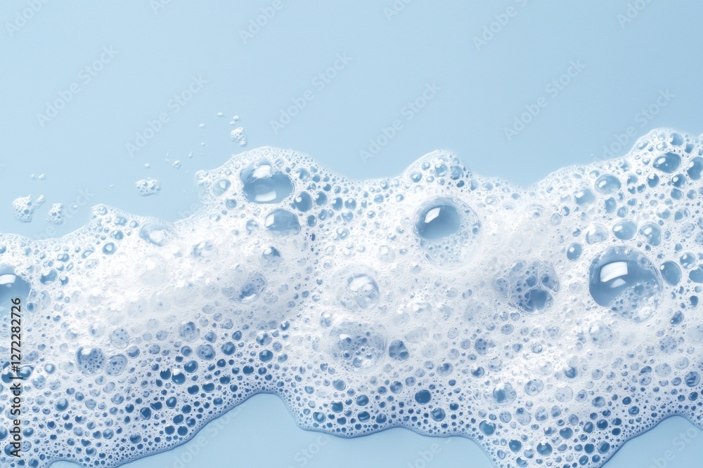 Poster white soap foam creates a mesmerizing pattern of bubbles against a tranquil blue background, evoking
