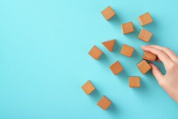Illustrating a ladder career path for business growth and success through hand-arranged wooden blocks stacked in steps, with an upward arrow