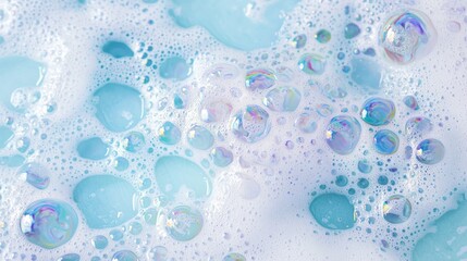A mesmerizing collection of colorful soap foam features various sizes of bubbles. The soft textures blend shades of blue and white, creating an inviting and whimsical atmosphere