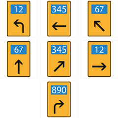 Multiple road signs indicating directions and route numbers