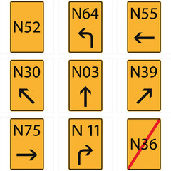 A set of yellow road signs showing route numbers and directional arrows to guide drivers along national roads