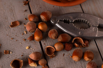 Vintage-style setup featuring a pot of hazelnuts with shells and spices. Perfect for promoting...