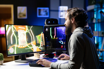 Man challenging other players in videogame tournaments online while streaming on internet. Pro gamer participating in esports contest during livestream with audience, showcasing gaming skills © DC Studio