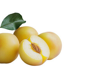 Close up of a yellow peach with a leaf on top, isolated