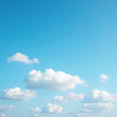 Fototapeta premium A fleet of white clouds moves swiftly across a brilliant blue winter sky, pale, fast, sky