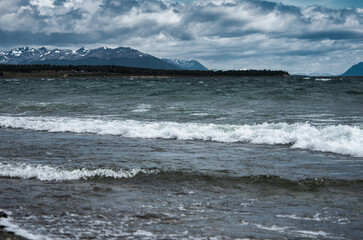 Patagonian lake shore, dramatic cliffs.