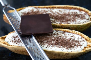 Traditional cupuaçu cream, cupuaçu mousse served in the fruit shell with grated chocolate