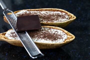Traditional cupuaçu cream, cupuaçu mousse served in the fruit shell with grated chocolate
