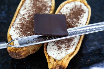 Traditional cupuaçu cream, cupuaçu mousse served in the fruit shell with grated chocolate