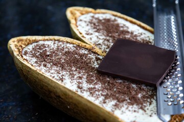 Traditional cupuaçu cream, cupuaçu mousse served in the fruit shell with grated chocolate