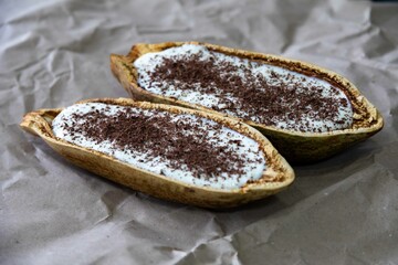 Traditional cupuaçu cream, cupuaçu mousse served in the fruit shell with grated chocolate