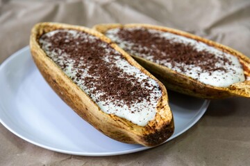 Traditional cupuaçu cream, cupuaçu mousse served in the fruit shell with grated chocolate