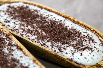 Traditional cupuaçu cream, cupuaçu mousse served in the fruit shell with grated chocolate