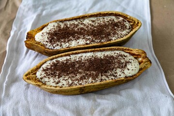 Traditional cupuaçu cream, cupuaçu mousse served in the fruit shell with grated chocolate
