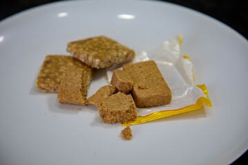 Paçoquinha is a sweet, crumbly Brazilian peanut candy made from ground peanuts and sugar, often enjoyed as a nostalgic snack