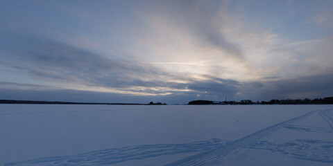 Winter fishing on the lake, beautiful panorama.
