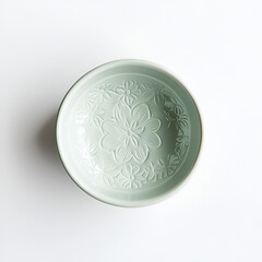 Ceramic bowl with flower pattern. Soft pastel colors. Floral design dinnerware, bowl viewed from above.