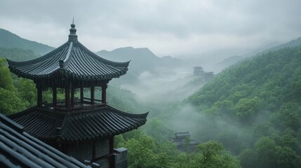 Obraz premium Ancient Pagoda Overlooking Misty Mountain Valley