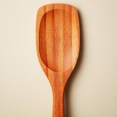 Wooden ladle on a plain background ideal for cooking recipes and kitchenware product shots