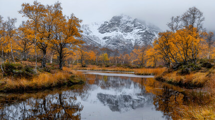 Fototapeta premium Autumnal lake reflecting snowy mountain, serene landscape
