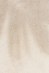 Summer minimal style background with shadow from natural palm leaf on light beige concrete...