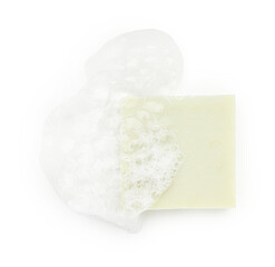 Light green soap with foam on white background, top view