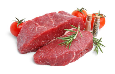 Pieces of raw beef meat, spices and tomatoes isolated on white