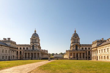 Obraz premium Two Domes at Old Royal Naval College Queen Anne Court, Greenwich, England, United Kingdom on a Summer day