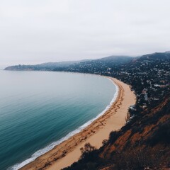 Coastal view of a beach, city, and fog.  High angle beach panorama