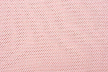 ピンクの生地を背景に