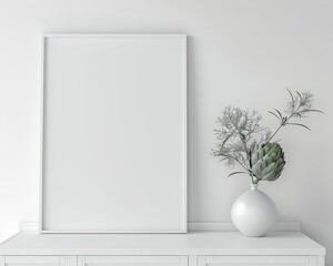 White frame mockup with a vase of artichoke and greenery on a white dresser against a white wall