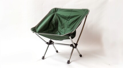A portable aluminum folding camping chair with a green fabric seat, unfolded and set against a white background.