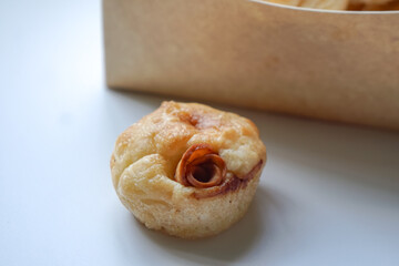 Close up view of Sourdough Focaccia Bread Muffins with pepperoni on white background in selective focus.