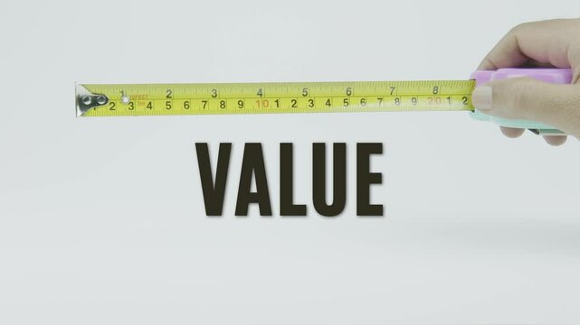 "Value" text with a yellow tape measure on a white background, symbolizing precision, accuracy, and worth measurement in a clean, minimal video